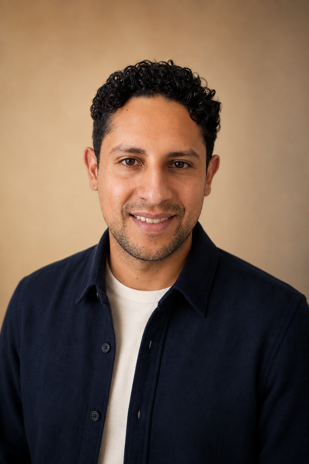 Martin Vega in a professional navy overshirt